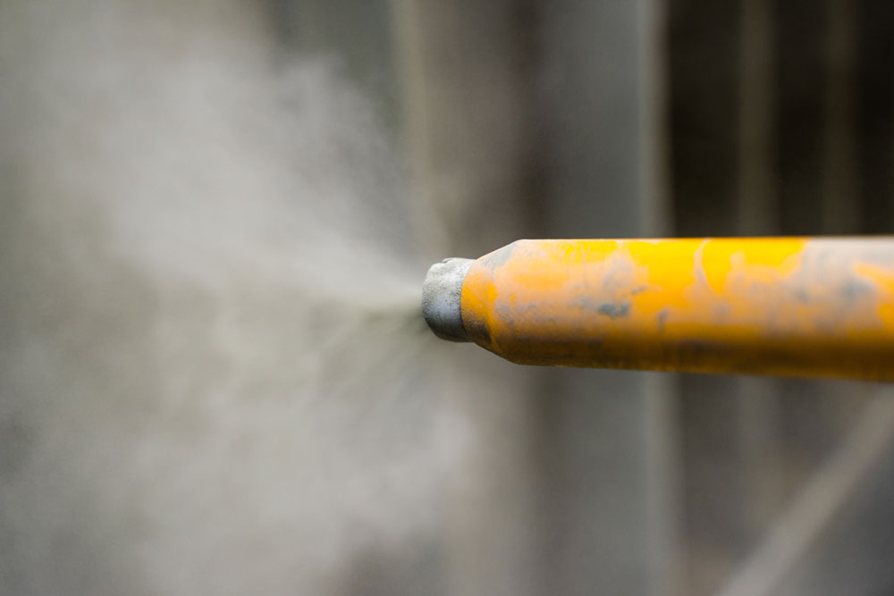 Industrial machinery sandblasting for professional painting preparation
